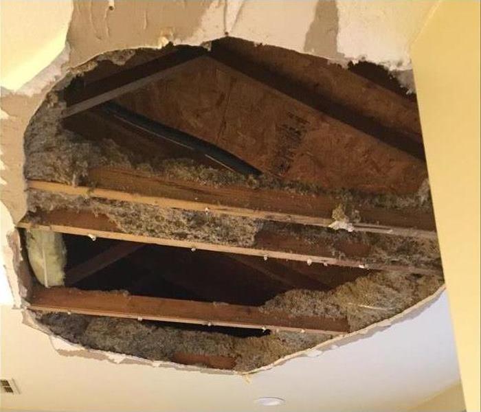 hole in bathroom ceiling after rain